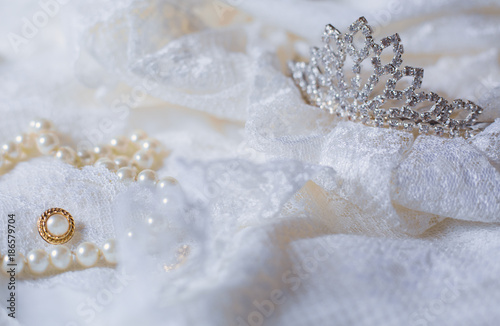 Tiara and white pearls with wedding dress