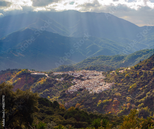 Small Spanish mountain town highlighted with sun beam in Andalusia, Spain © gorelovs