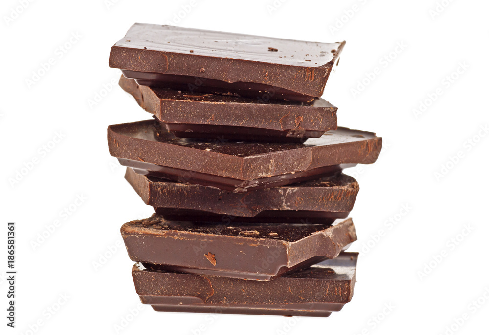 Broken bar of dark chocolate isolated on white background