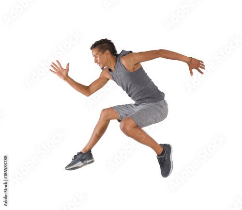 Young man jumping isolated on white