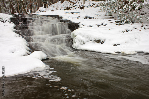 Snowy Waterfall in the Woods
