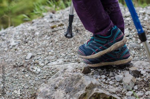 child's feet walk along the mountain path