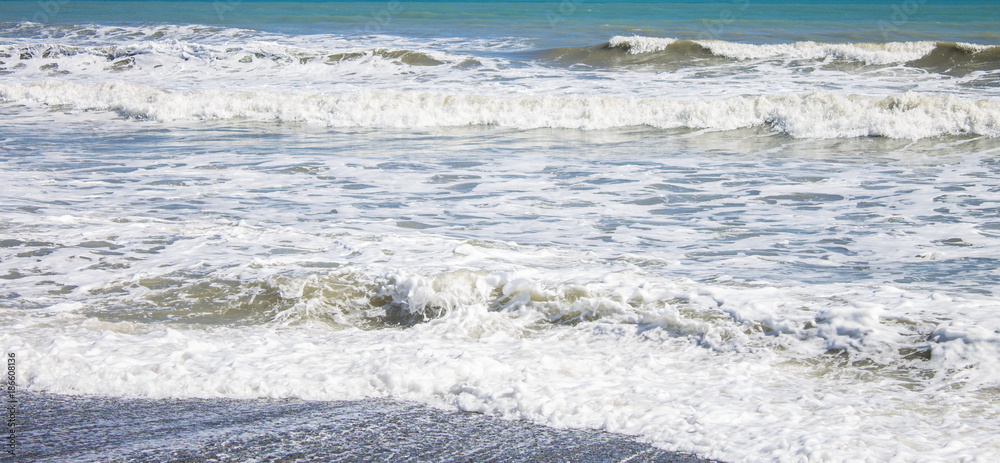 Fototapeta premium Close up image of waves coming in on Otaki Beach on the Kapiti Coast of New Zealand.