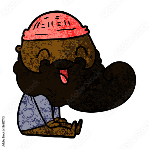 happy bearded man sat down laughing