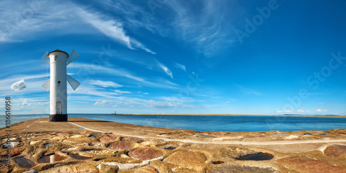 Panoramic image of an old lighthouse in Swinoujscie, a port in Poland on the Baltic Sea
