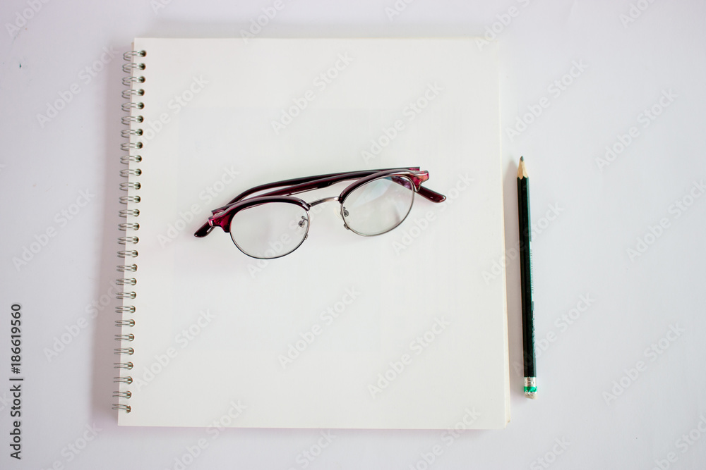 diary pen and glasses on white background diary pen and glasses on white background