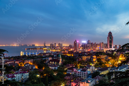 Qingdao Bay and the Lutheran church seen from the hill of Signal Park at evening, Qingdao, China