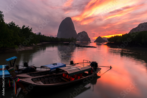 Long tail boat to light the morning sunrise, Ban Hin Rom , Phang Nga, Thailand.