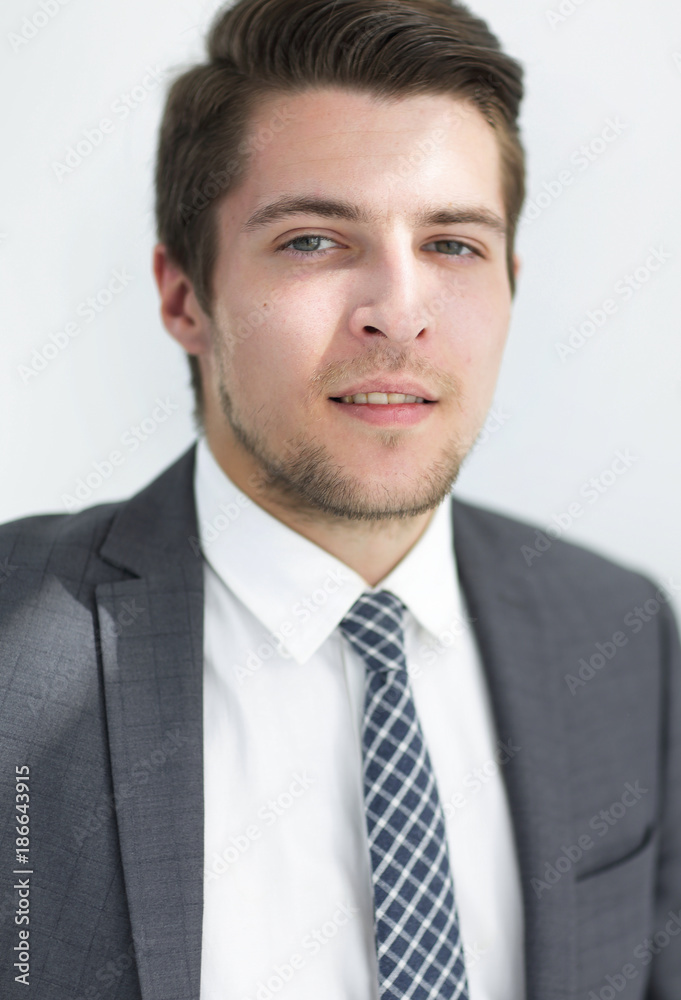 closeup.the face of a successful young man closeup.the face of a successful young man