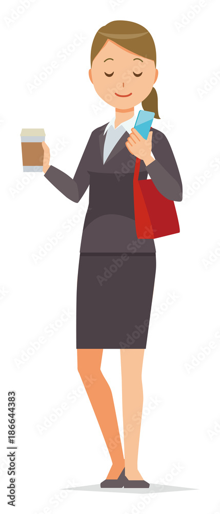 Business woman in suit wears coffee and is manipulating smartphone Business woman in suit wears coffee and is manipulating smartphone
