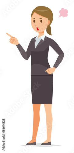 A business woman in a suit is angrily pointing to a finger