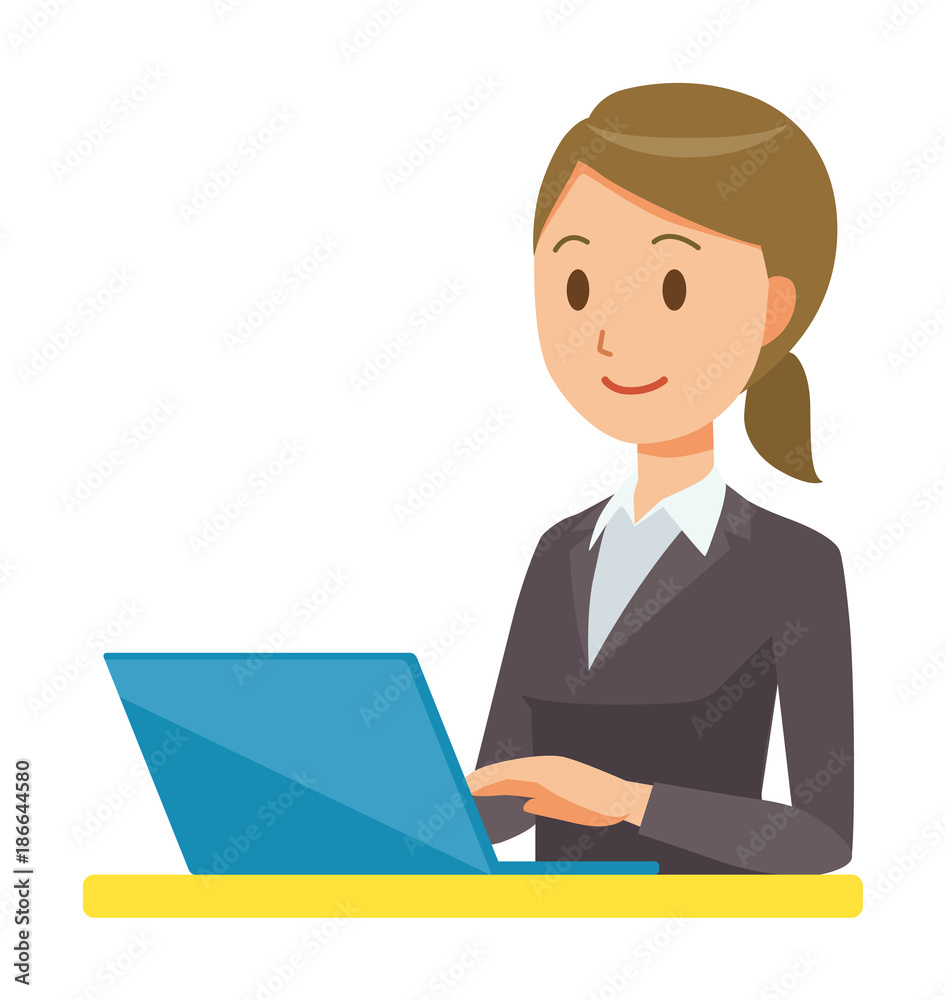 A business woman in a suit is operating a laptop computer A business woman in a suit is operating a laptop computer