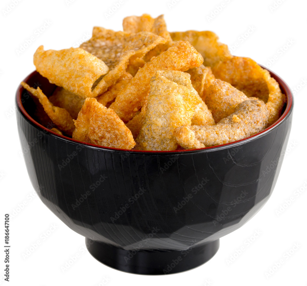 Crispy fried salmon skin in cup.