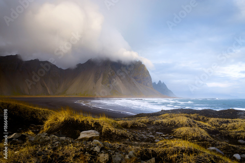 The rugged Vestrahorn mountains at Hofn, Iceland, viewed from the black sand beach at Stokksnes. © beau