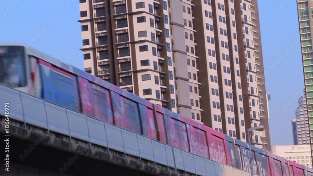 Bangkok, 1 January 2018; Cityscape and easy traffic on the road and modern sky-train in Bangkok, Thailand in warm morning or afternoon light. Bangkok, 1 January 2018; Cityscape and easy traffic on the road and modern sky-train in Bangkok, Thailand in warm morning or afternoon light.