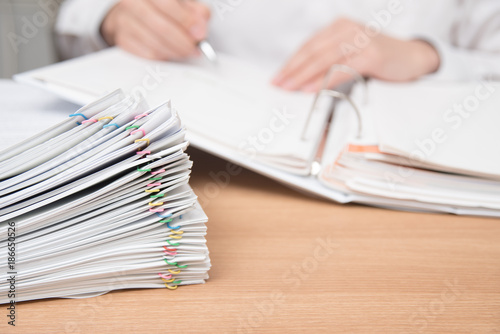 A pile of documents with the man in the document