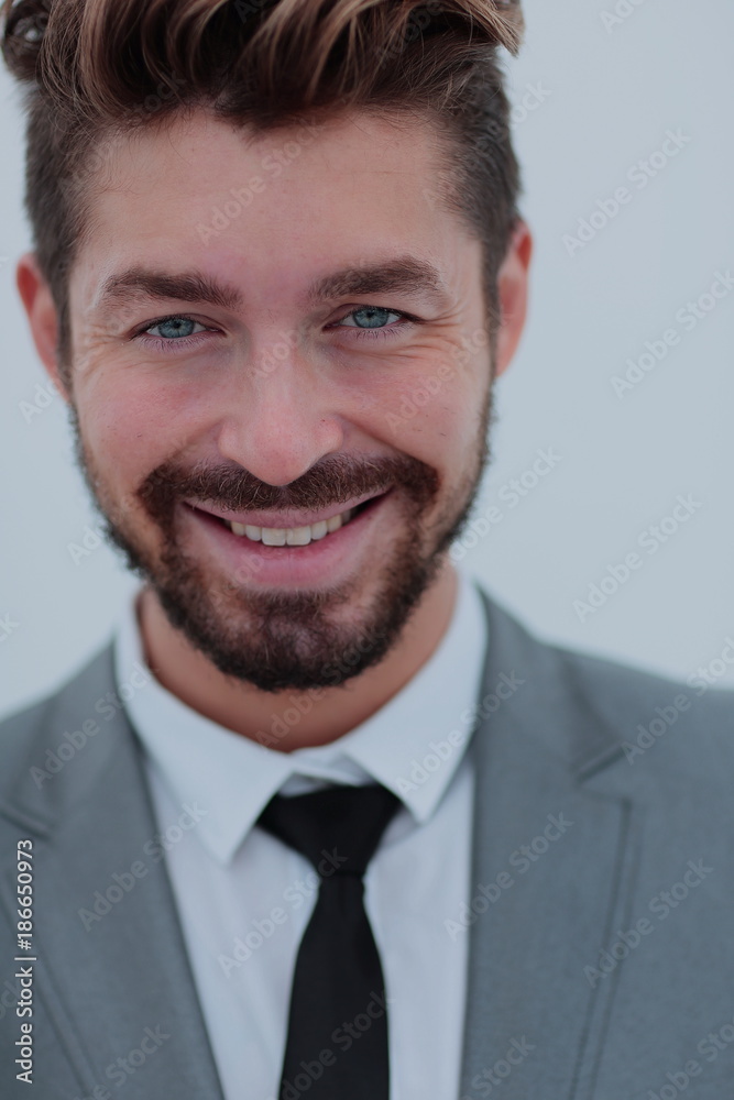 Close up portrait of a smiling handsome business man over white Close up portrait of a smiling handsome business man over white