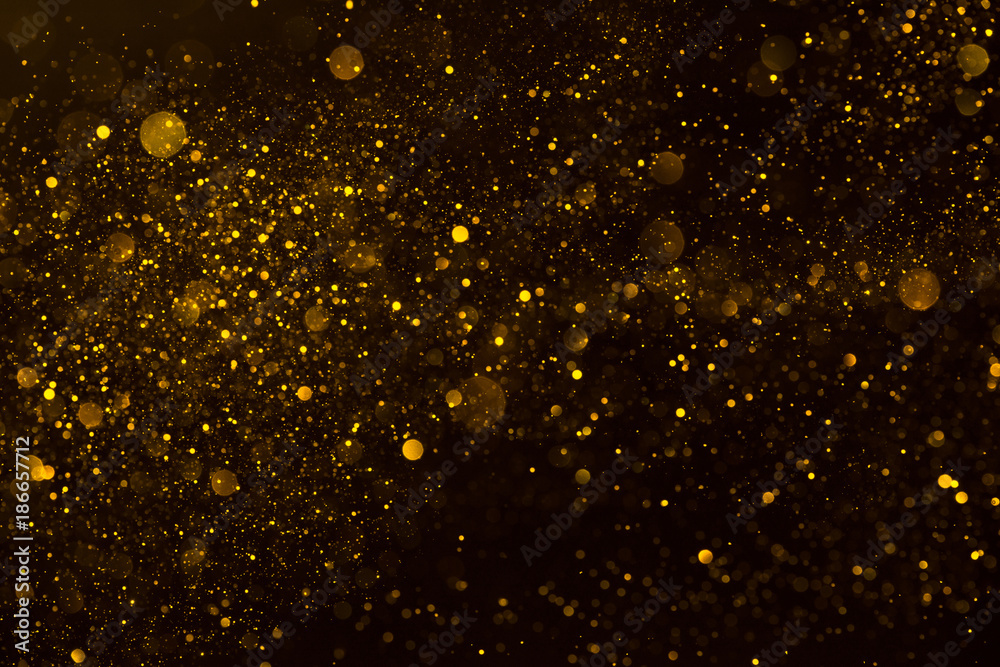 Golden stardust flow glitter shiny abstract background - obrazy, fototapety, plakaty 