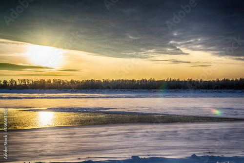 sunset on the river in winter