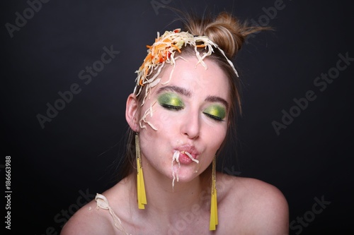 girl is eating cabbage photo