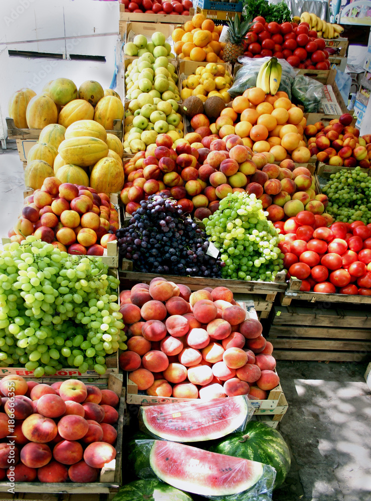 Versatile fruits on market stalls.