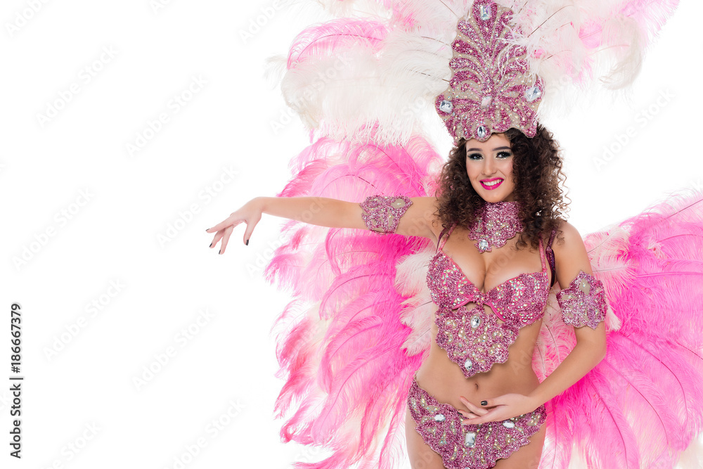 smiling girl posing in carnival costume with pink feathers, isolated on white smiling girl posing in carnival costume with pink feathers, isolated on white