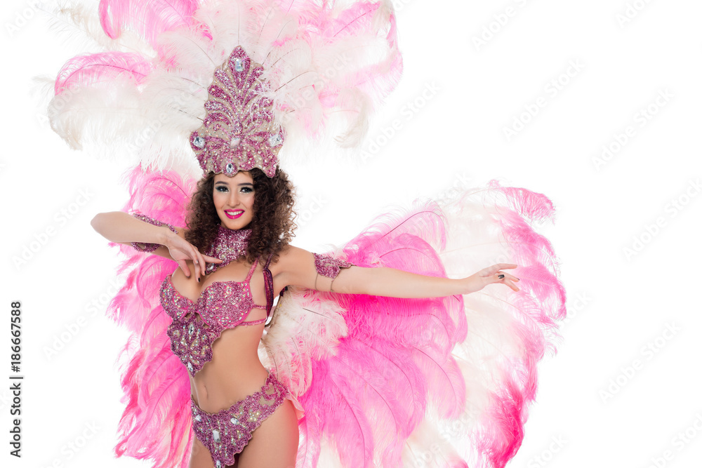 seductive girl dancing in carnival costume with pink feathers, isolated on white