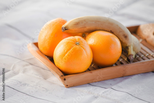 oranges and bananas on a white background