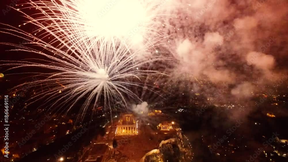 Fireworks explode over the temple of the Parthenon at the Acropolis hill during the New Year celebrations in Athens, Greece