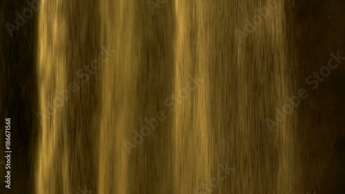 Sand falling in slow motion on dark black background in abstract fashion form. Studio slow motion footage