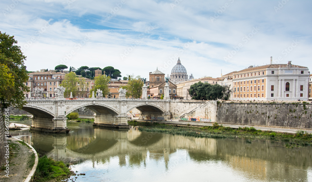 View of Tiber river with St Peter's Basilica and Ponte Vittorio Emanuele II, Rome, Italy