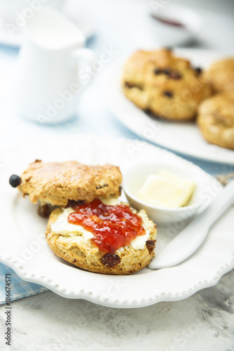 Fresh homemade scones with butter and jam