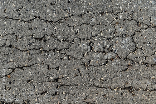 detail surface of broken asphalt road in countryside