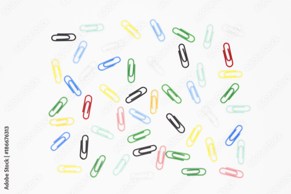 colorful paper clips and clothespins isolated