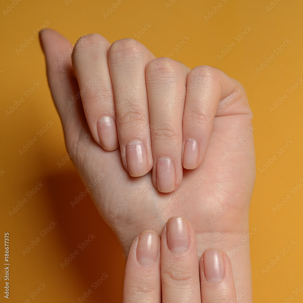 Hands on a yellow background Hands on a yellow background