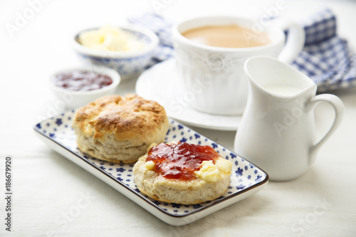Fresh homemade scones with butter and jam