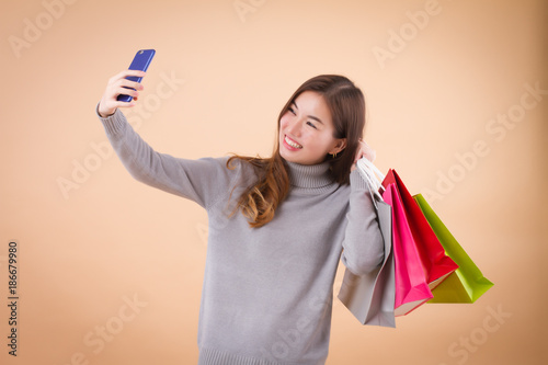 woman shopper shopping and doing selfie photo upload
