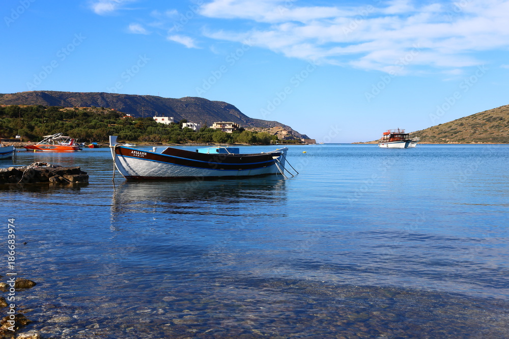 panoramic view of the boat on the clear water on the island of Crete, Greece