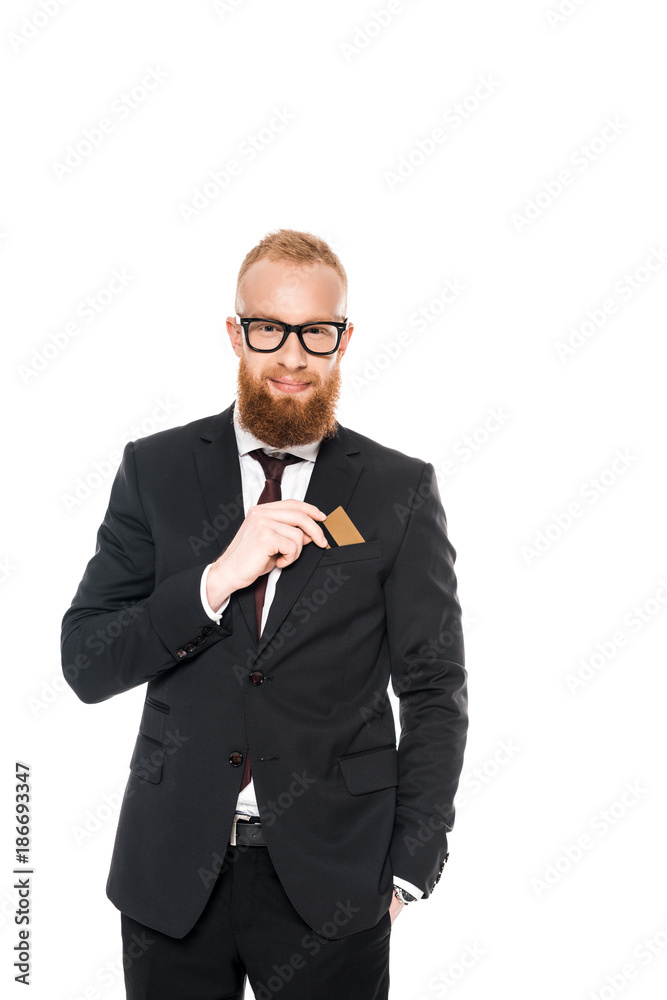 handsome bearded businessman in eyeglasses holding credit card and smiling at camera isolated on white handsome bearded businessman in eyeglasses holding credit card and smiling at camera isolated on white