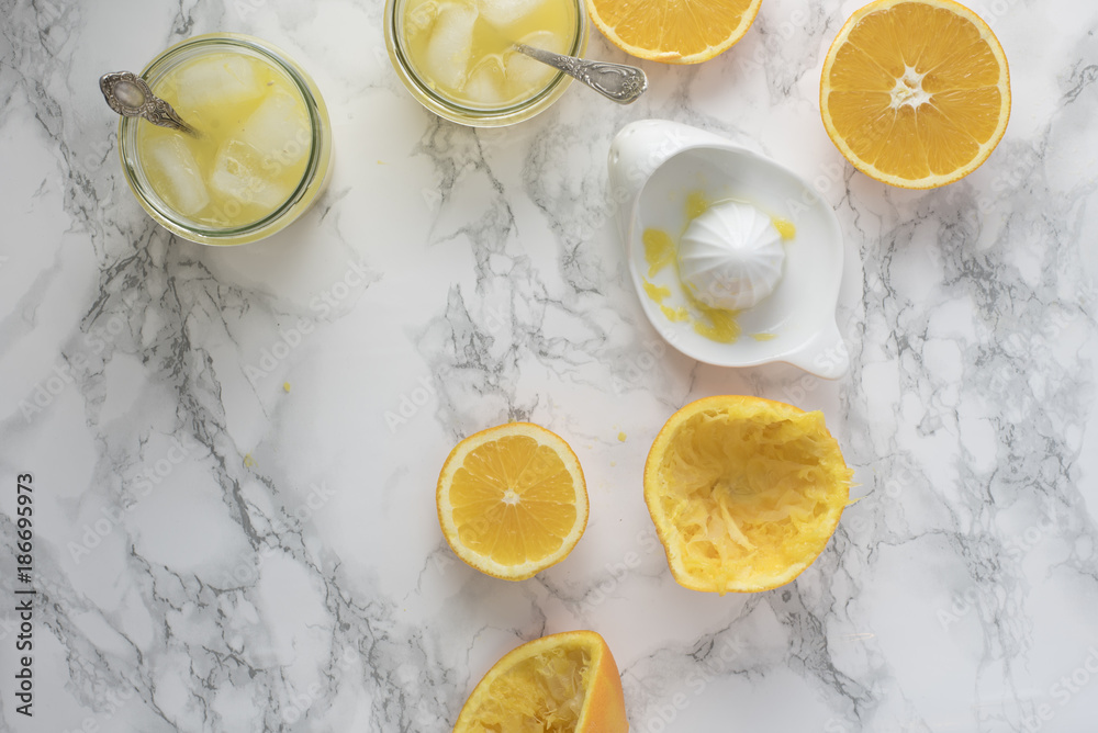 Freshly Squeezed Orange Juice on Marble Table Freshly Squeezed Orange Juice on Marble Table