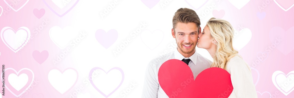 Valentines couple holding heart with love hearts background Valentines couple holding heart with love hearts background