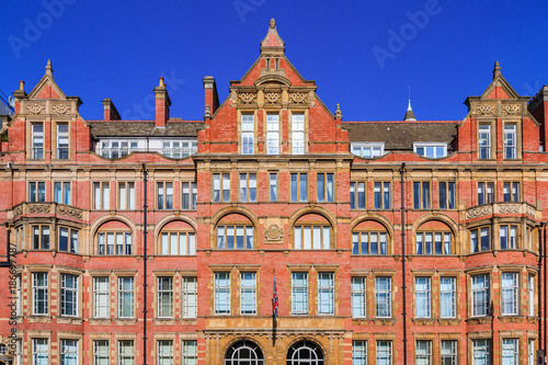 Facade of an old red brick mansion in London
