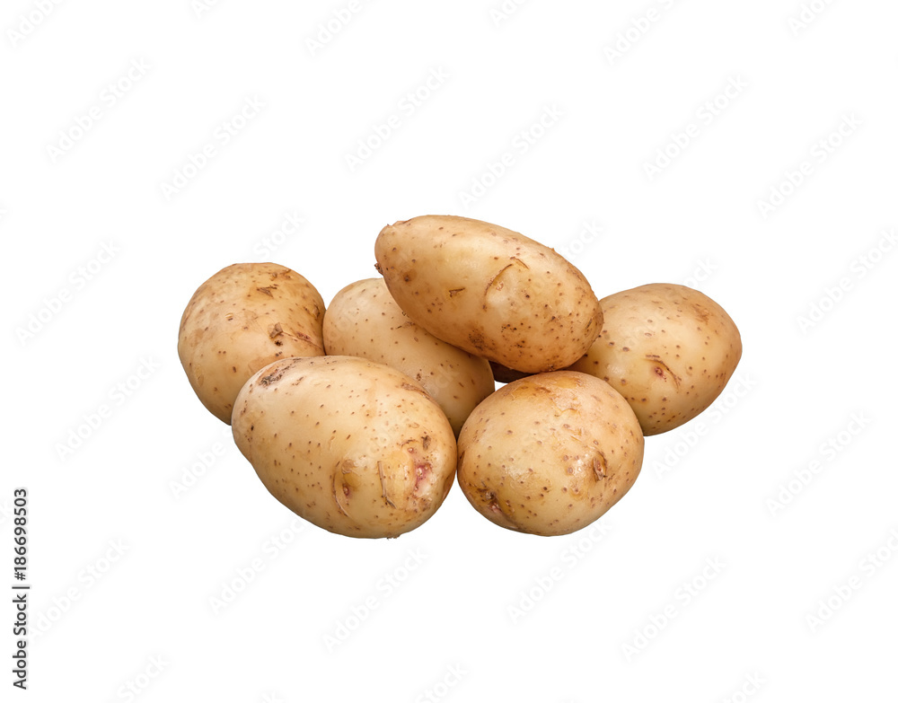 Young thin-skinned washed potatoes lies on a white background. Isolated on a white background. Young thin-skinned washed potatoes lies on a white background. Isolated on a white background.