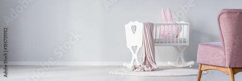 White cradle in baby's bedroom photo