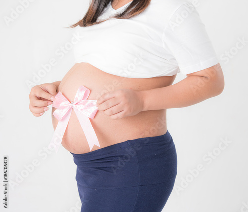 Wallpaper Mural Pregnant woman with pink ribbon on the white Torontodigital.ca