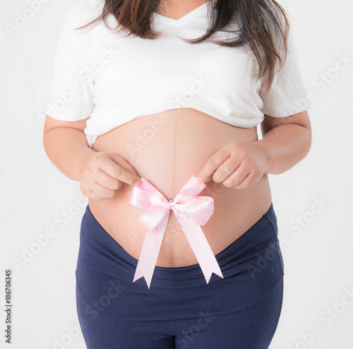 Wallpaper Mural Pregnant woman with pink ribbon on the white Torontodigital.ca