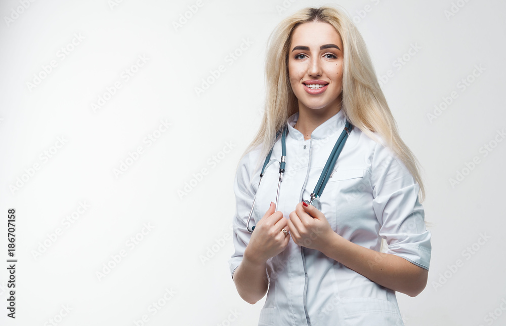 Smiling medical doctor woman with stethoscope. Isolated over white background Smiling medical doctor woman with stethoscope. Isolated over white background