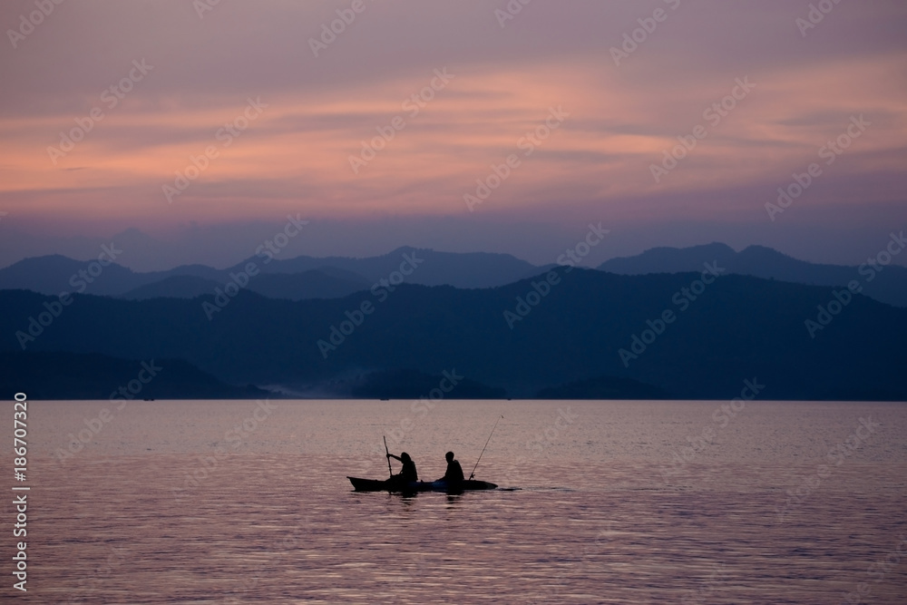 mountain view with kayak boat when sunset time