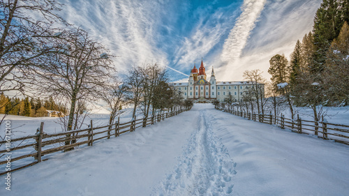 Monastery of Pietralba near Monte San Pietro, Nova Ponente, South Tyrol, Italy. The most important sanctuary of South Tyrol. Winter view with snow. photo