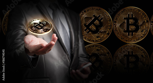 Businessman hold bitcoin, crypto currency conceptual, new generation of global currency